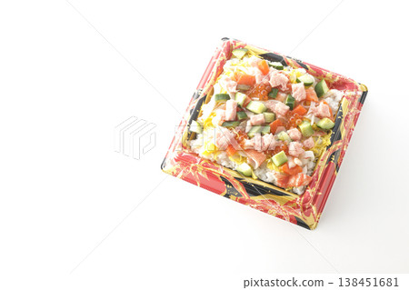 A photo of a generously topped chirashi sushi against a white background. A photo of a generously topped chirashi sushi against a white background. 138451681