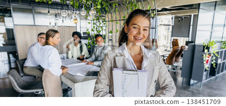 Asian entrepreneur engages clients in professional meeting setting Asian entrepreneur engages clients in professional meeting setting 138451709