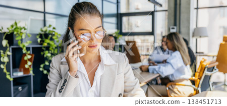 Focused account manager negotiating with team in professional manner 138451713