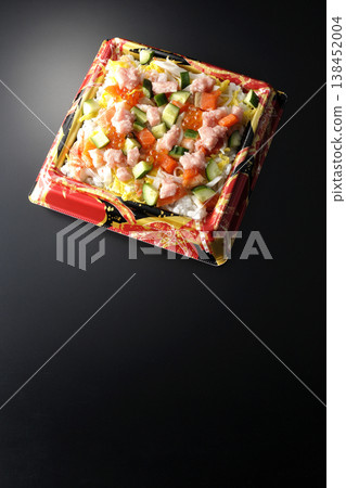 A photo of a generously topped chirashi sushi against a black background. 138452004