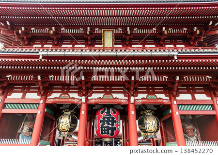 Building view of the Hozomon of Kinryu-zan Senso-ji in Asakusa, Tokyo, Japan. The gate hung with three large lanterns displayed the Nio statues on both sides. 138452270