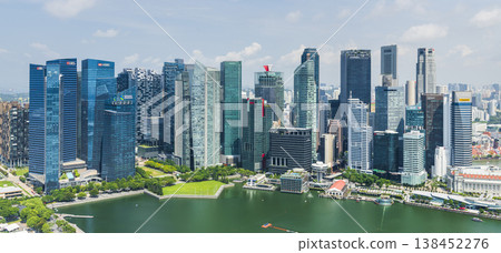 Building view of modern skyscrapers along Marina Bay in the Raffles Place financial district from the Marina Bay Sands Skypark, Singapore. Building view of modern skyscrapers along Marina Bay in the Raffles Place financial district from the Marina Bay Sands Skypark, Singapore. 138452276