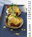 Eggs Benedict made with english muffin, grilled bacon, a brace of poached hen's eggs & hollandaise sauce and watercress. 138452332