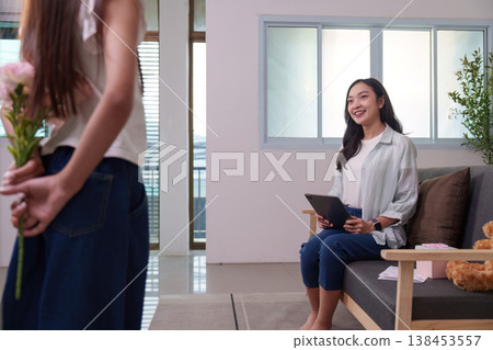 Mother and daughter sharing a heartfelt moment with flowers 138453557