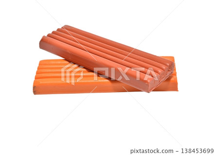 Several bars of brown plasticine. Several bars of brown plasticine. 138453699