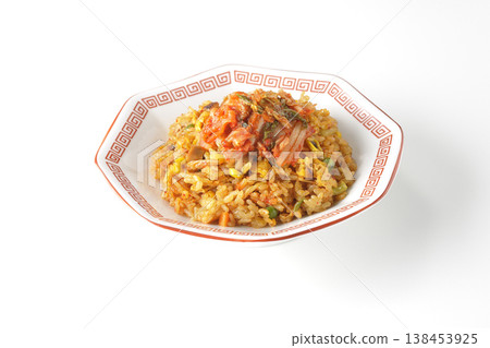 Spicy kimchi fried rice photographed alone against a white background. Spicy kimchi fried rice photographed alone against a white background. 138453925