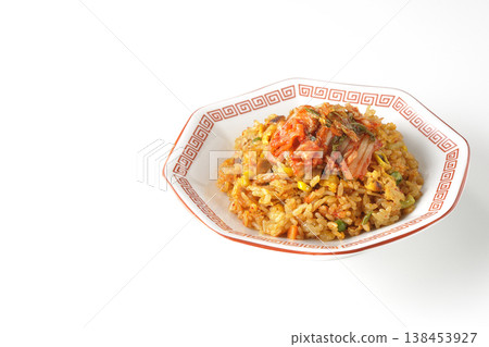 Spicy kimchi fried rice photographed alone against a white background. 138453927