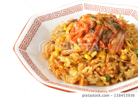 Spicy kimchi fried rice photographed alone against a white background. 138453936