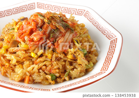Spicy kimchi fried rice photographed alone against a white background. Spicy kimchi fried rice photographed alone against a white background. 138453938