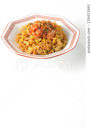 Spicy kimchi fried rice photographed alone against a white background. 138453941