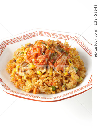 Spicy kimchi fried rice photographed alone against a white background. 138453943