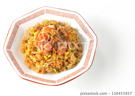 Spicy kimchi fried rice photographed alone against a white background. Spicy kimchi fried rice photographed alone against a white background. 138453957