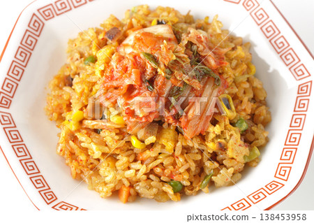 Spicy kimchi fried rice photographed alone against a white background. 138453958