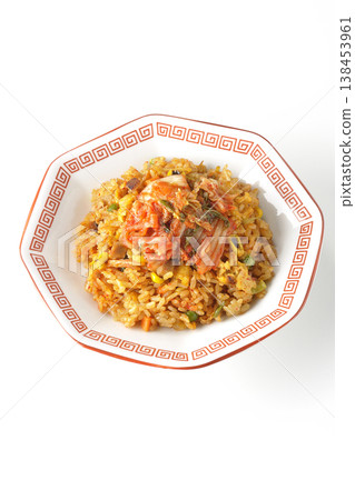 Spicy kimchi fried rice photographed alone against a white background. 138453961