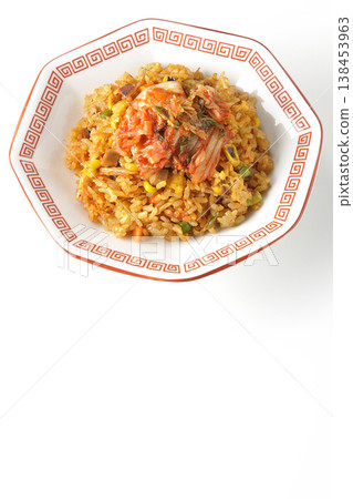 Spicy kimchi fried rice photographed alone against a white background. Spicy kimchi fried rice photographed alone against a white background. 138453963