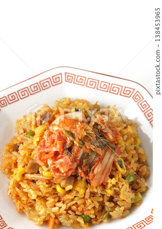 Spicy kimchi fried rice photographed alone against a white background. 138453965