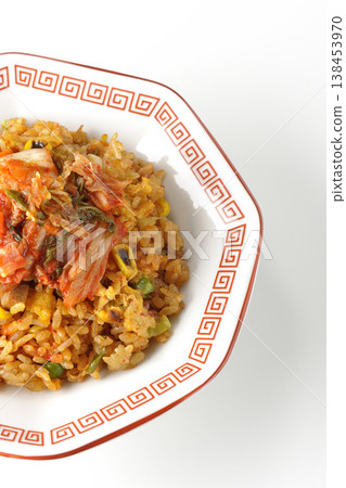 Spicy kimchi fried rice photographed alone against a white background. 138453970