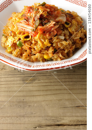 A single serving of spicy kimchi fried rice. 138454080