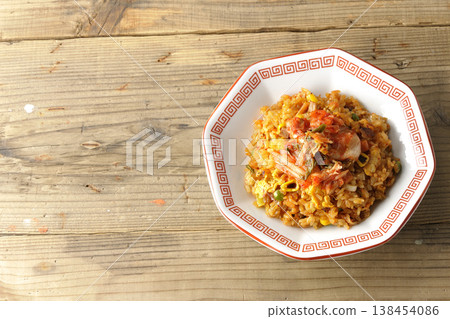 A single serving of spicy kimchi fried rice. A single serving of spicy kimchi fried rice. 138454086