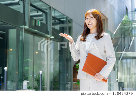 Business woman standing in the office Business woman standing in the office 138454379