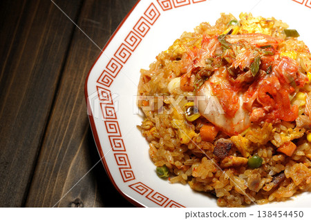 A single serving of spicy kimchi fried rice. A single serving of spicy kimchi fried rice. 138454450