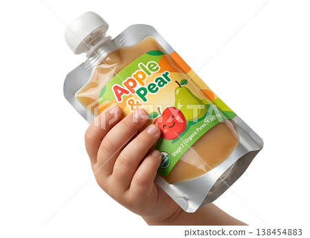 Small child's hand gripping a squeezable baby food pouch labeled apple and pear, representing convenient, healthy snacking for toddlers on the go Small child's hand gripping a squeezable baby food pouch labeled apple and pear, representing convenient, healthy snacking for toddlers on the go 138454883