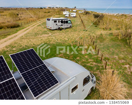 Caravan with tilt solar panels on roof. Aerial view. 138455069