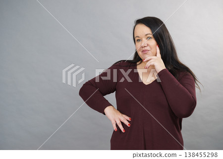 Thinking adult woman 138455298