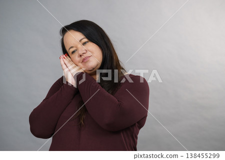 Woman being sleepy gesturing 138455299