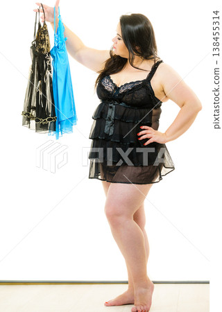 Plus size woman fitting satin nightwear 138455314