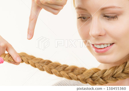 Blonde young woman with braid hair Blonde young woman with braid hair 138455360