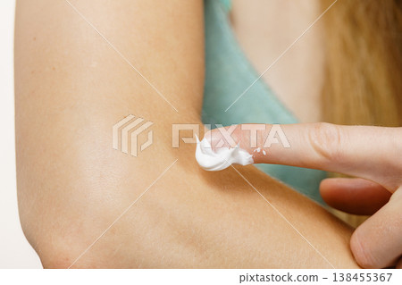 Woman apply moisturizer cream on her body Woman apply moisturizer cream on her body 138455367