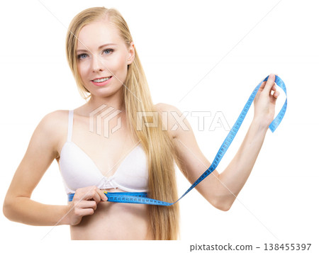 Woman measuring her chest under breast Woman measuring her chest under breast 138455397