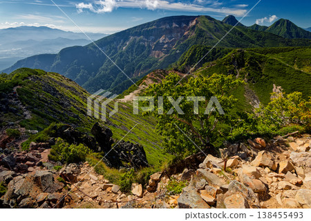 A view of Mt. Iou, Mt. Akadake, Mt. Amidadake, and the Okuchichibu mountain range from Higashi-Tengudake in the Yatsugatake mountain range. 138455493