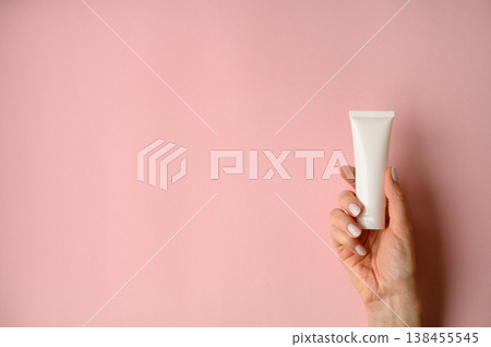 A white empty tube for cream, paste, gel, or shampoo as a mockup. An empty cosmetic tube A white empty tube for cream, paste, gel, or shampoo as a mockup. An empty cosmetic tube 138455545
