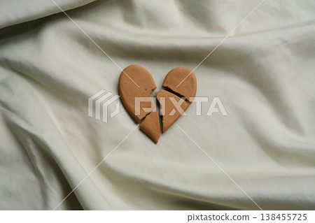 Broken heart on textile. divorce concept. Broken heart on textile. divorce concept. 138455725