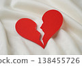 Broken red heart on white textile. divorce concept. 138455726
