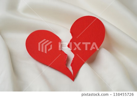 Broken red heart on white textile. divorce concept. 138455726
