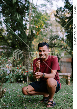 Exploring Nature by Touching Wild Plant with Tiny Red Fruits Exploring Nature by Touching Wild Plant with Tiny Red Fruits 138455868
