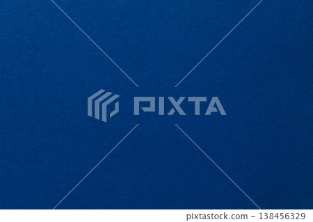 Deep blue textured paper background with subtle gradient for versatile design and copy space 138456329