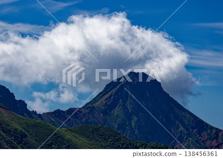 Mount Akadake, shrouded in clouds, as seen from Mount Nishitengu in the Yatsugatake mountain range. Mount Akadake, shrouded in clouds, as seen from Mount Nishitengu in the Yatsugatake mountain range. 138456361