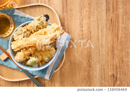 Tendon: A rice bowl topped with tempura shrimp and vegetables. 138456469