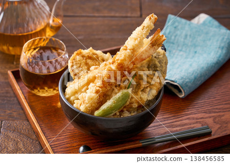 Tendon: A rice bowl topped with tempura shrimp and vegetables. Tendon: A rice bowl topped with tempura shrimp and vegetables. 138456585