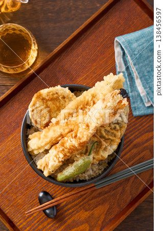 Tendon: A rice bowl topped with tempura shrimp and vegetables. Tendon: A rice bowl topped with tempura shrimp and vegetables. 138456597