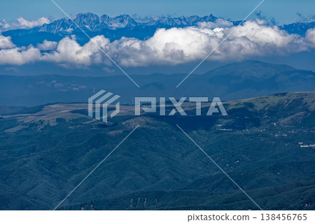 The Yari-Hotaka mountain range, shrouded in clouds, as seen from Nishitengu-dake in the Yatsugatake mountain range. 138456765