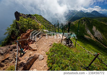 Clouds gathering around the main peaks of the Yatsugatake mountain range, as seen from Higashi-Tengudake. Clouds gathering around the main peaks of the Yatsugatake mountain range, as seen from Higashi-Tengudake. 138456772