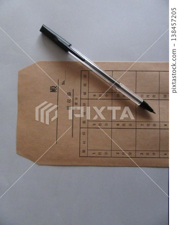 Tuition envelope and ballpoint pen 138457205