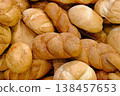 Various types of white wheat bread - loaves, baguettes, buns, rolls 138457653