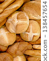 Various types of white wheat bread - loaves, baguettes, buns, rolls 138457654