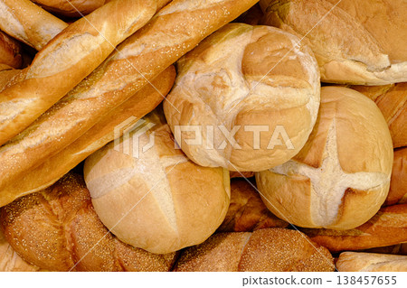 Various types of white wheat bread - loaves, baguettes, buns, rolls Various types of white wheat bread - loaves, baguettes, buns, rolls 138457655